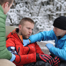 Load image into Gallery viewer, Practice assessing patient vital signs in a wilderness setting in our Wilderness First Responder Recertification (WFC) courses.