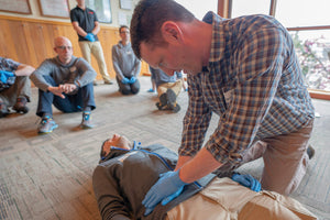 Remote EMT student learns how to perform a abdominal exam